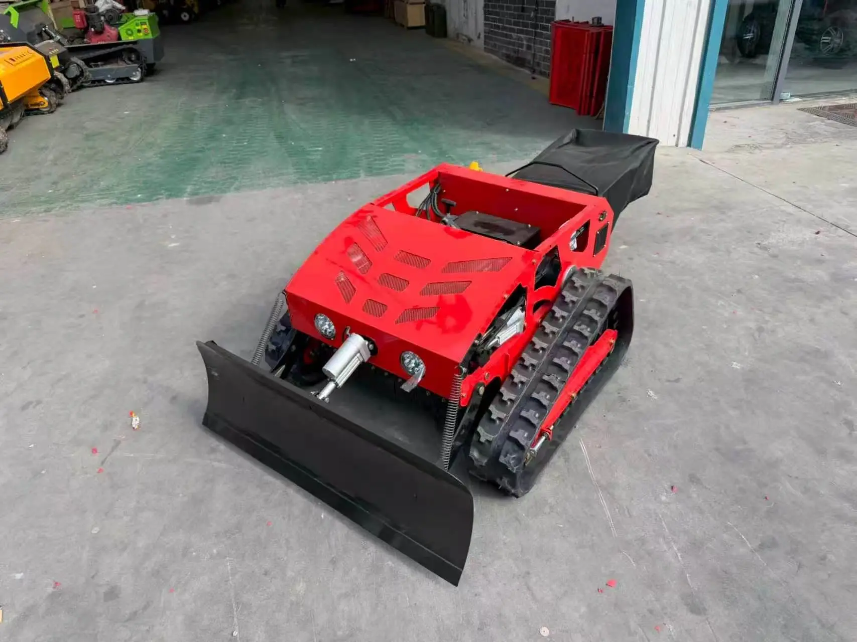 Trimmora TerraTrak 550 – Remote-Control Lawn Mower with Snow Plow and Grass Bags